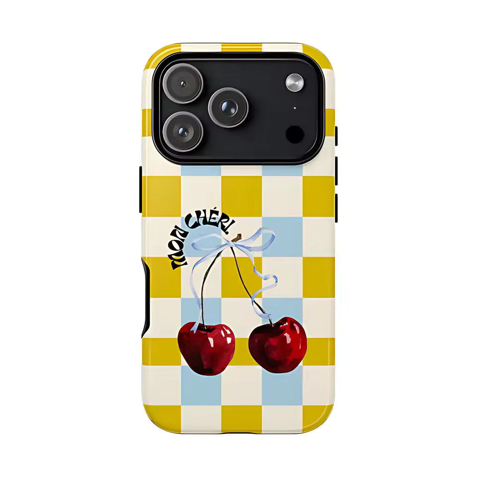 Phone case with checkered pattern, cherries, and 'Mon Cheri' text on a white background