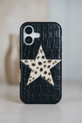 Black crocodile-patterned phone case with a star design on a light background